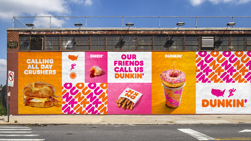 A wall of Dunkin advertisements.
